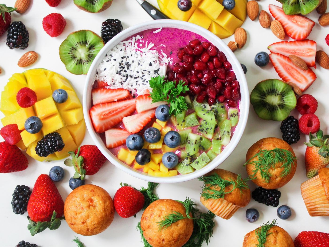 A colorful fruit bowl and fresh ingredients